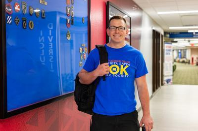 paper graduate cap on pile of cash