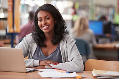 student with computer