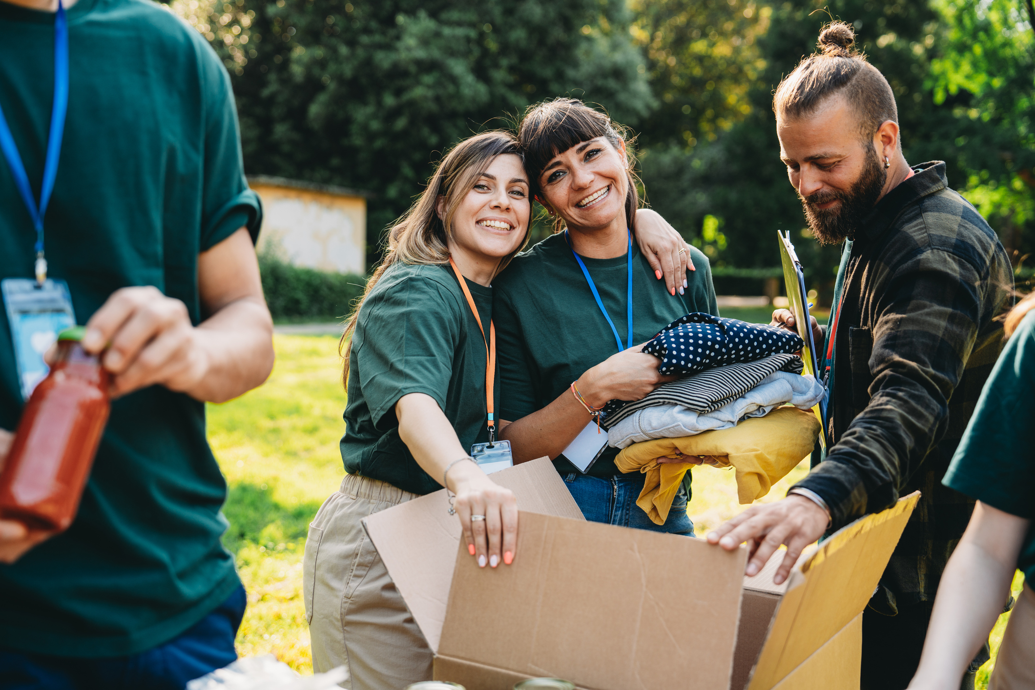 two females hugging while volunteering for disaster relief