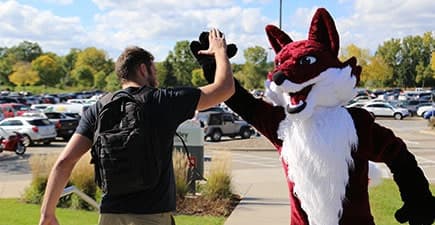 FVTC student high-fives Sly Fox