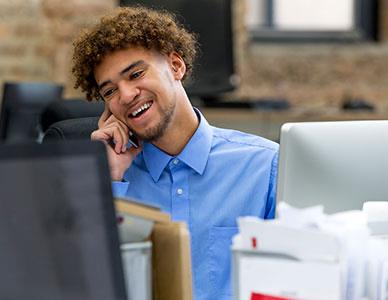 person in office talking on the phone