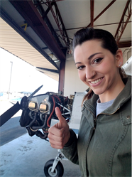 Ashley performing an oil change as an FVTC student