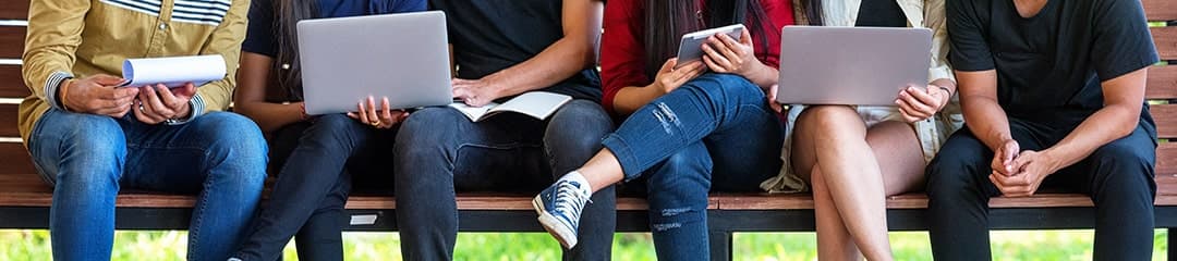 students sitting with laptops